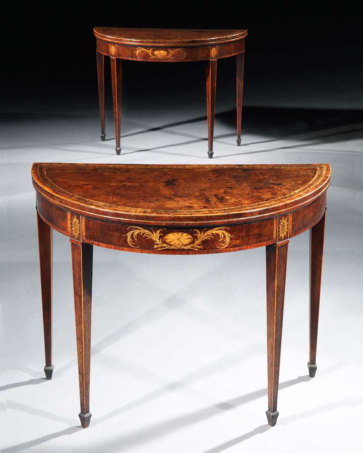A fine pair of George III period mahogany demi-lune card tables of excellent colour and patina